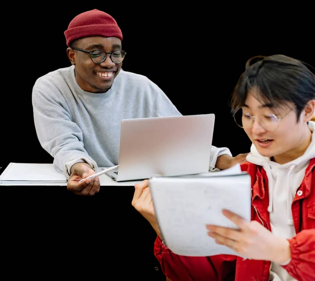Two international students working together on their application to a Spanish university